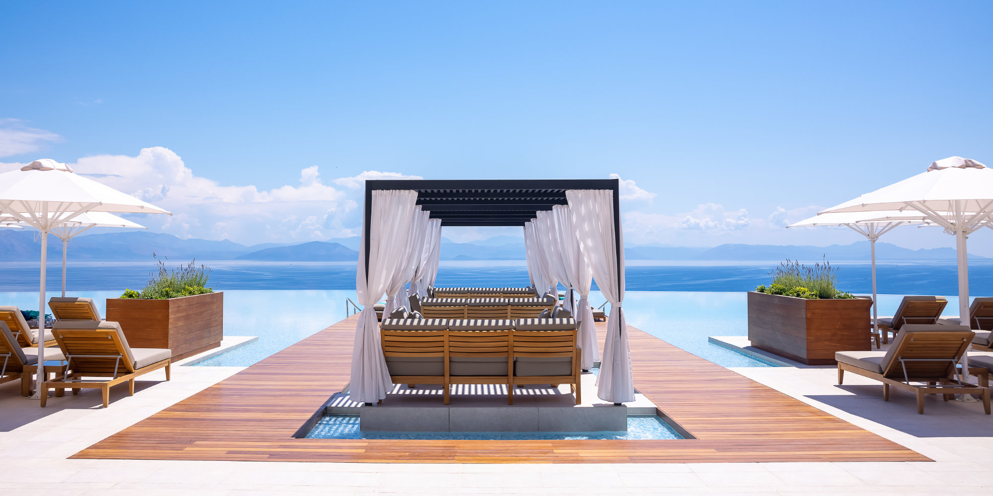Angsana_infinty pool deck with bali beds WIDE MAIN